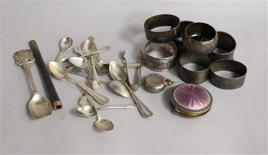 Five silver napkin rings, a silver sovereign case and a small quantity of small silver flatware etc.